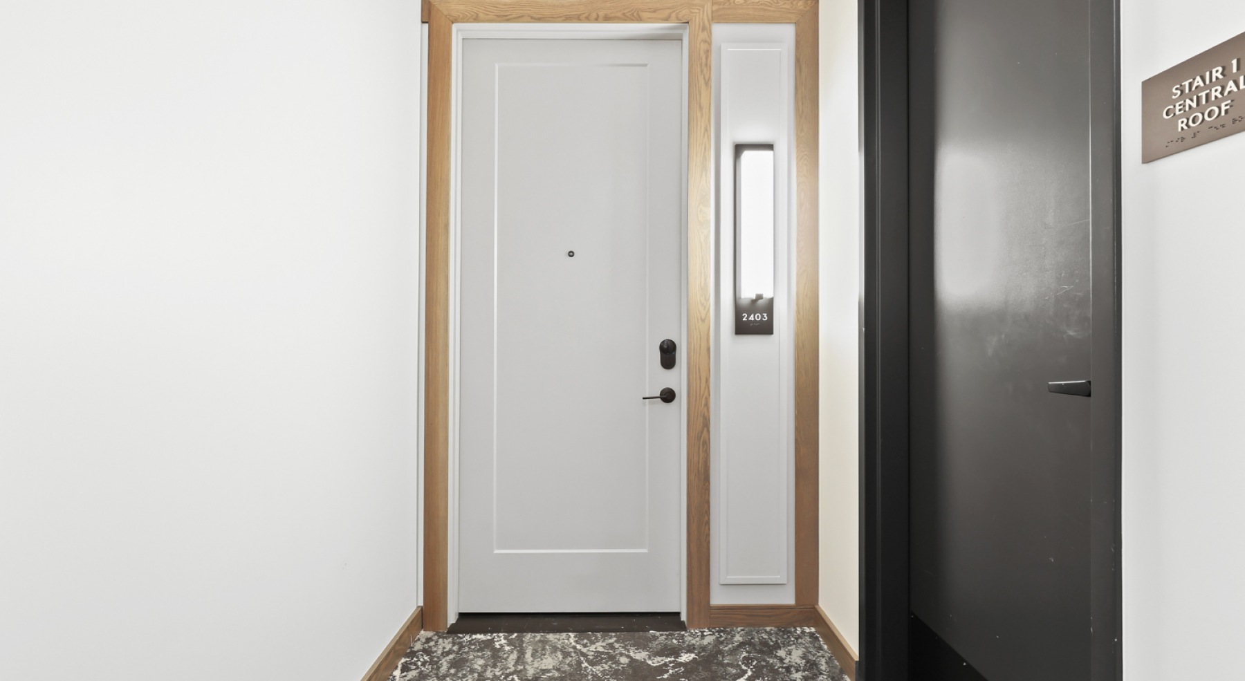 a front door with a wood frame