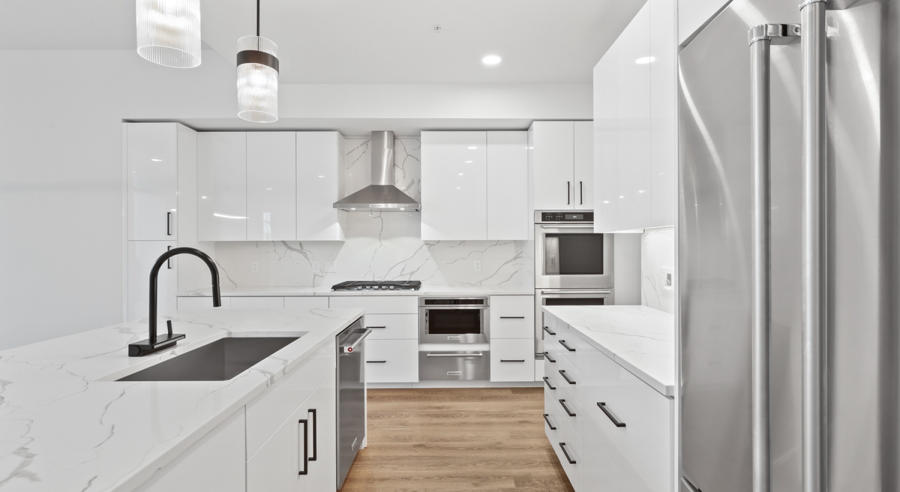 a kitchen with white cabinets