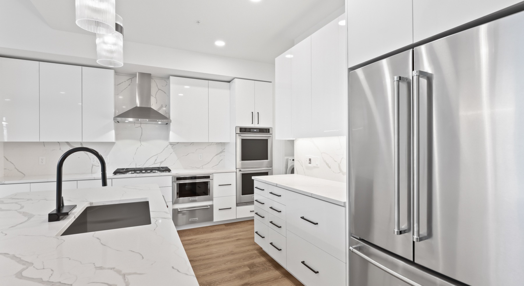 a kitchen with white cabinets