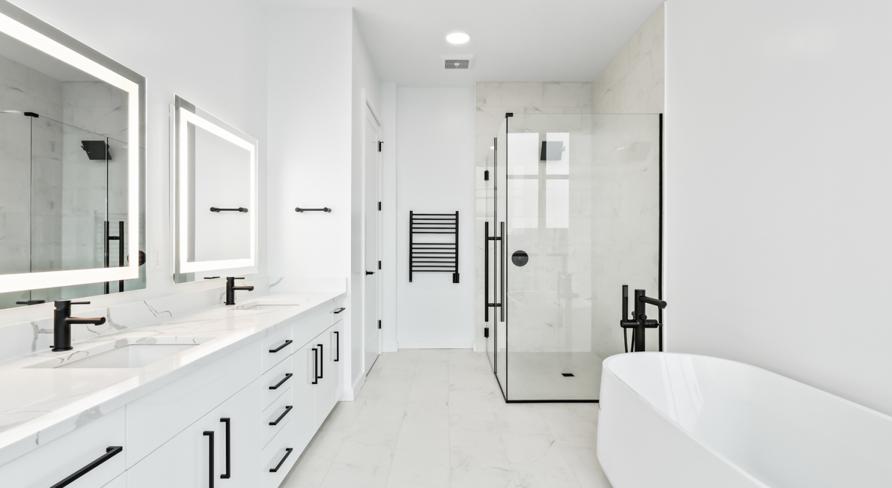 a bathroom with a sink, mirror and shower