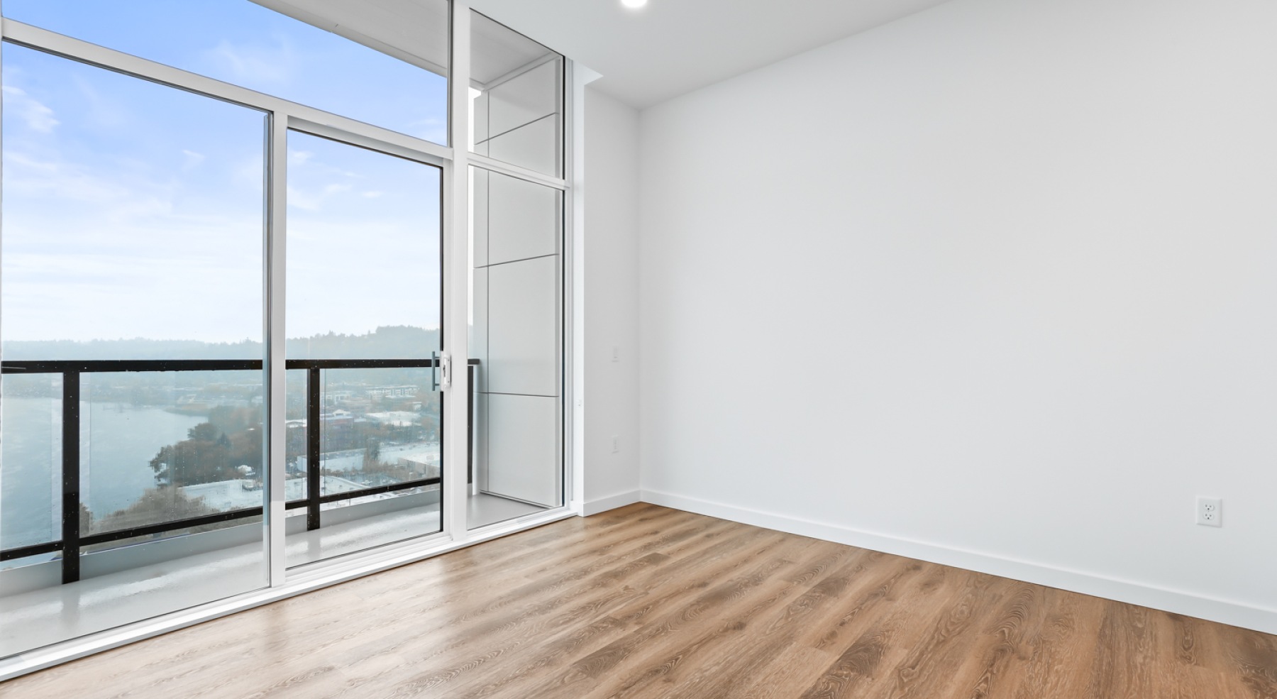 a room with white walls and wood floors