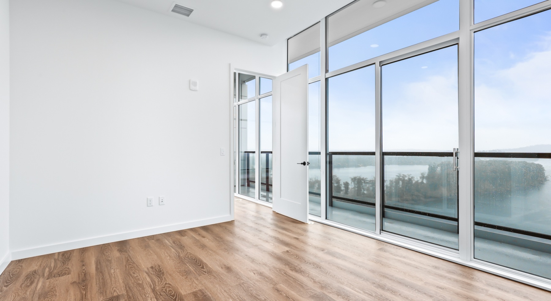 a room with white walls and wood floors