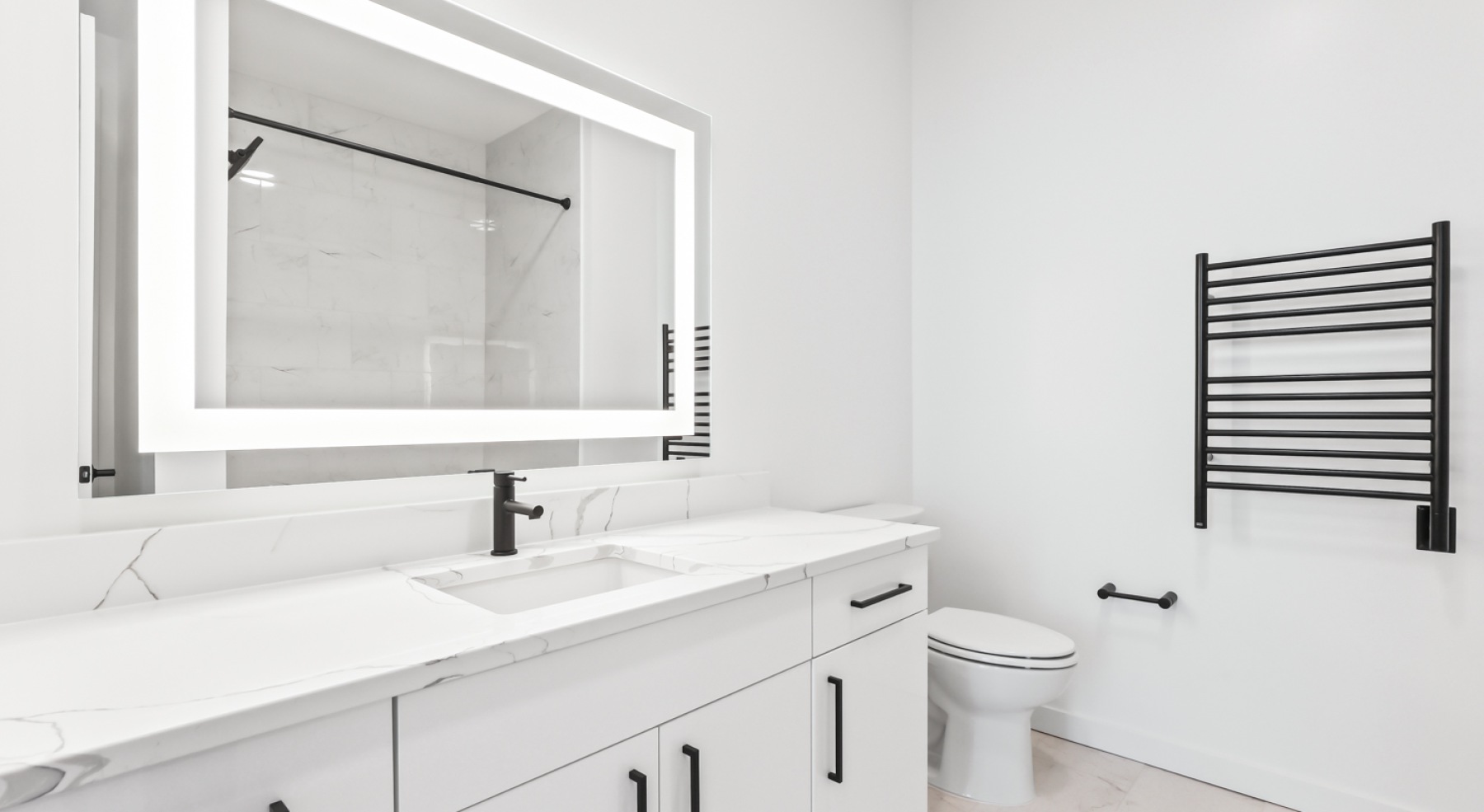 a bathroom with a sink, mirror and toilet