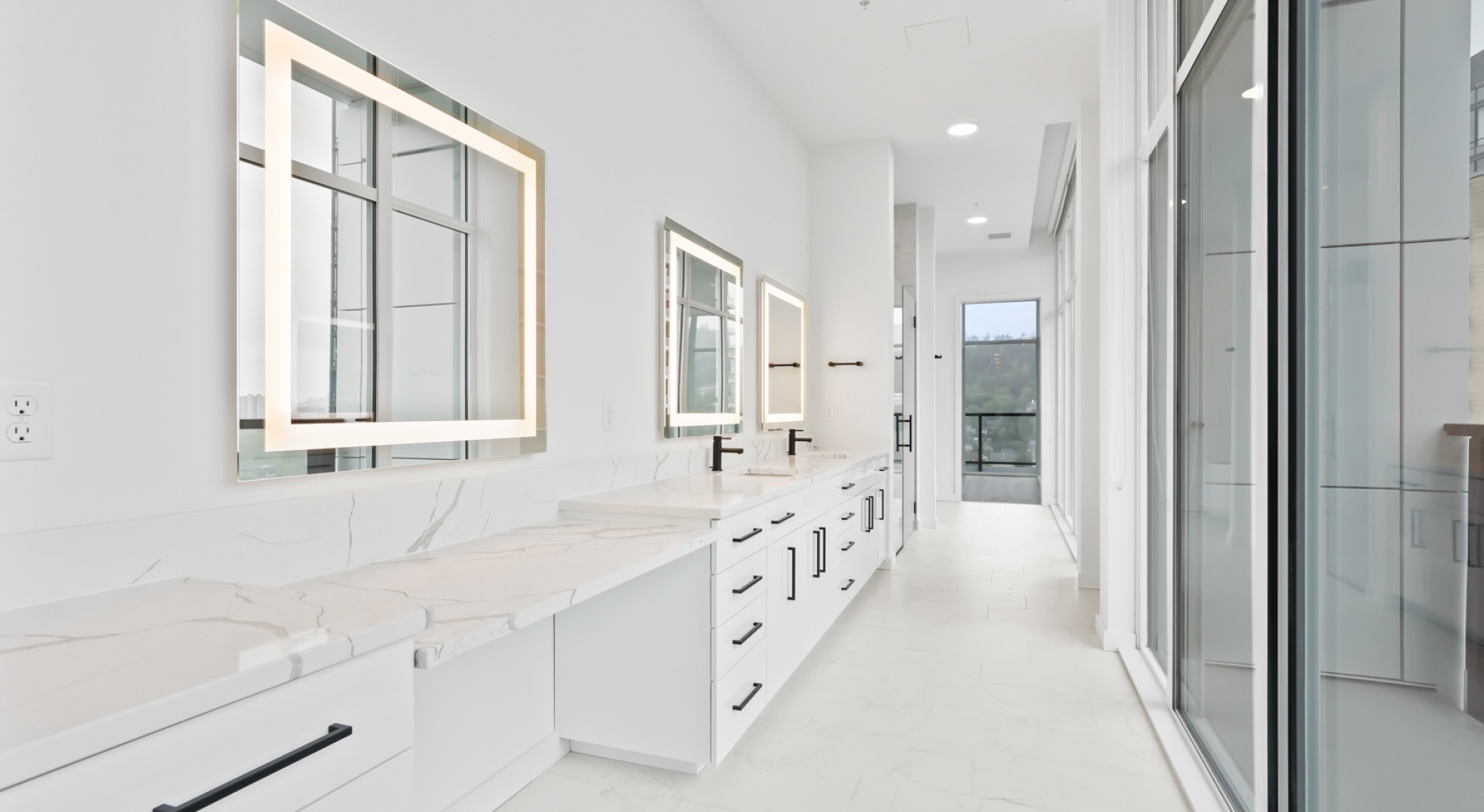 a bathroom with a sink, mirror and shower