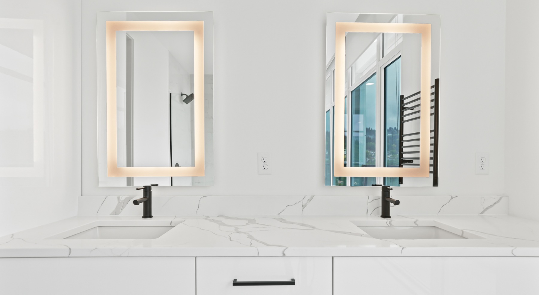 a bathroom with a sink and mirrors