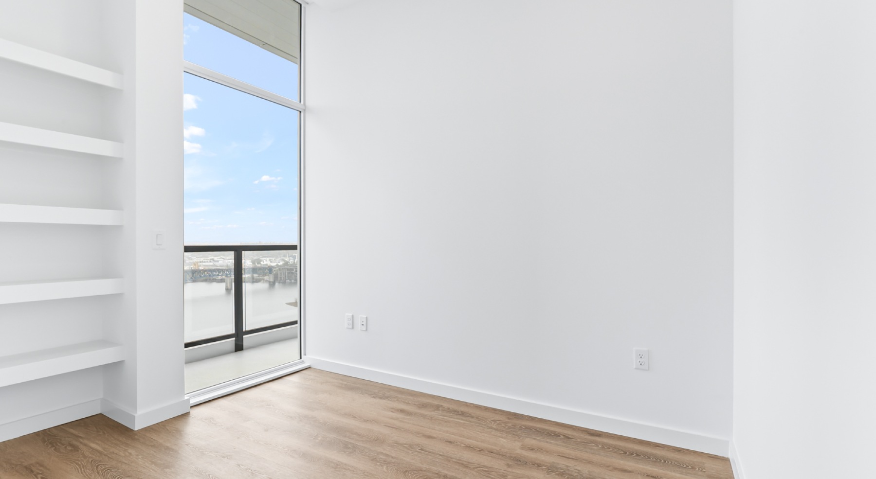 a room with white walls and wood floors