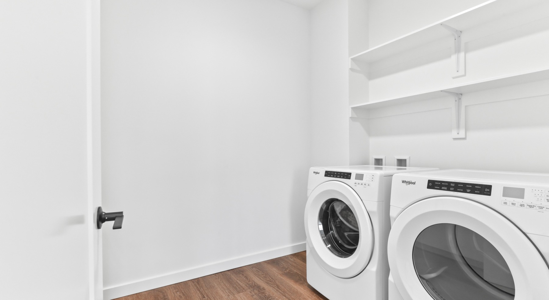 a laundry room with a washer and dryer