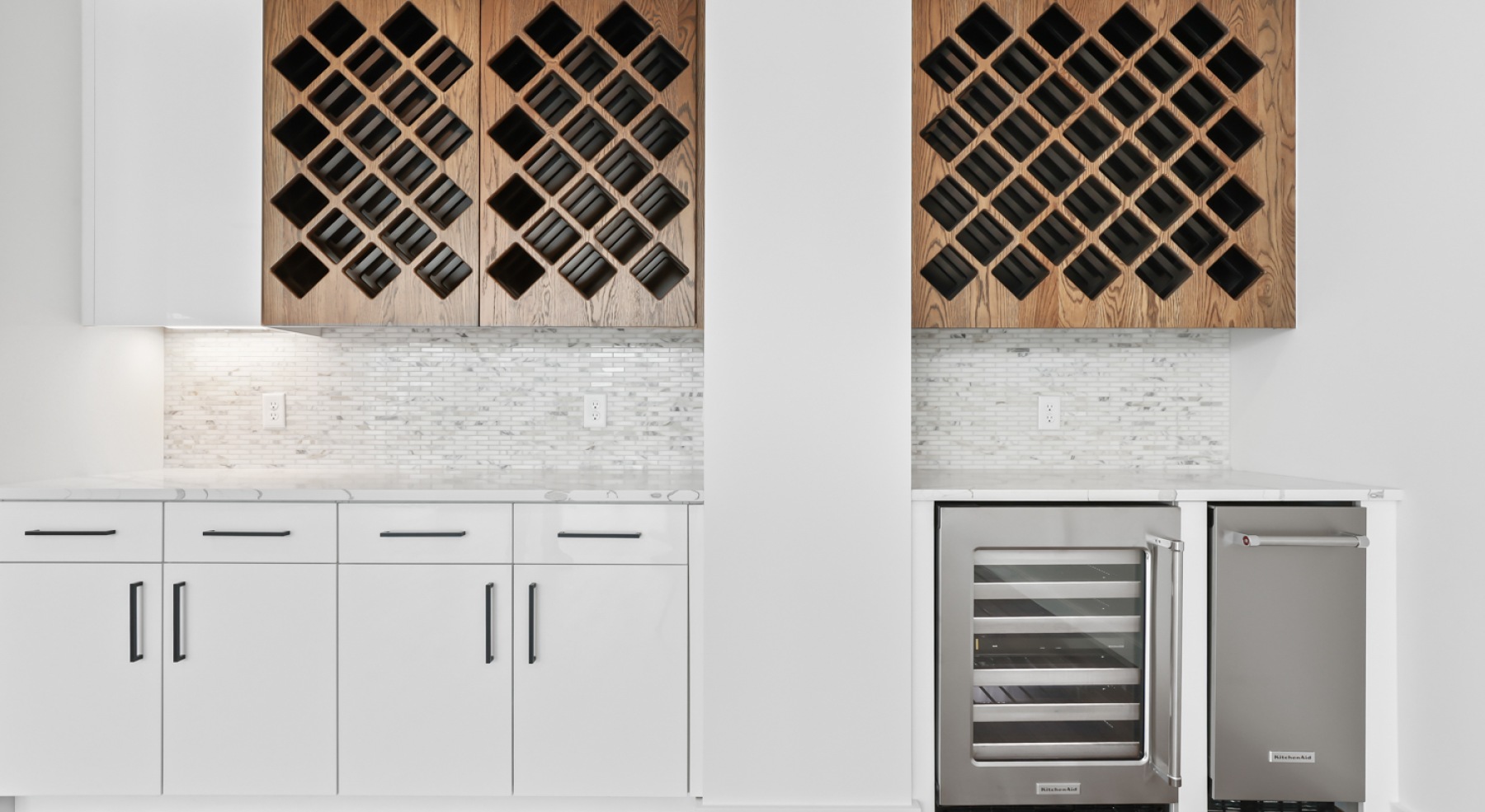 a kitchen with white cabinets