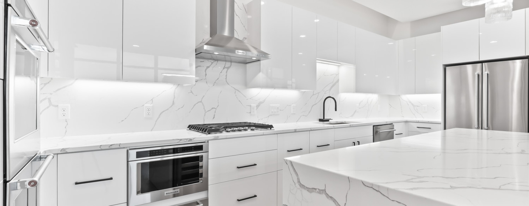 a kitchen with white cabinets