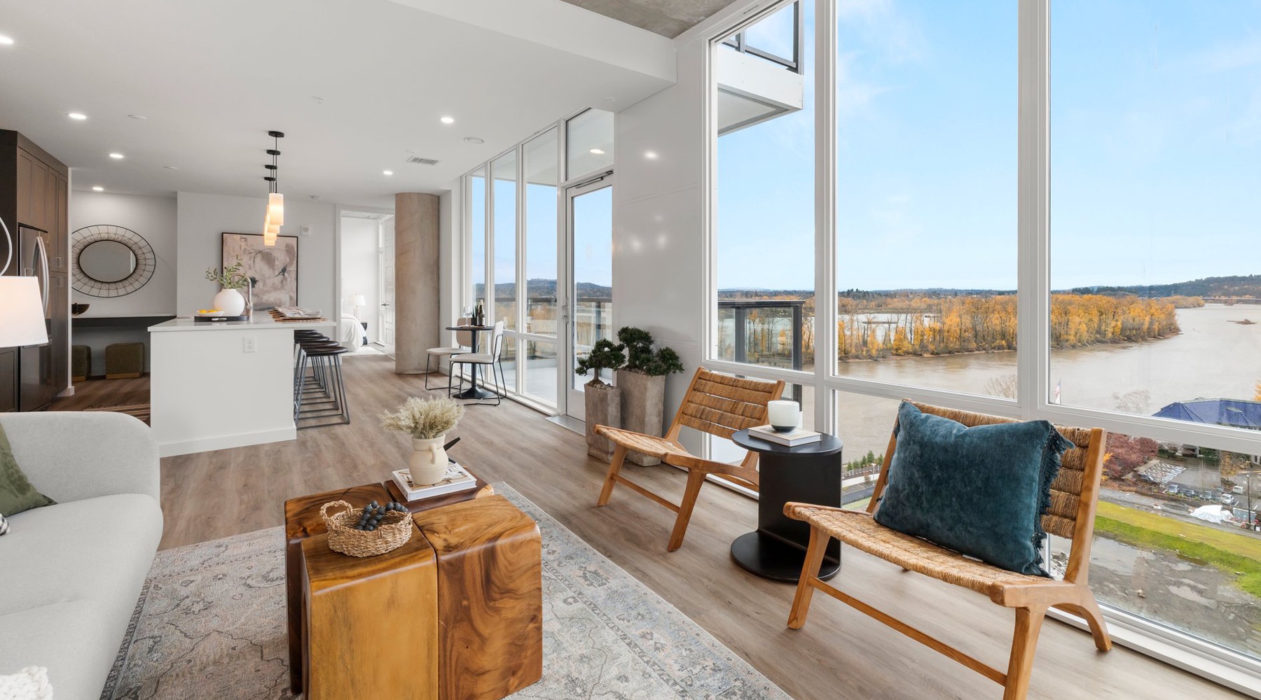 Open concept living room and kitchen at Willamette Tower apartments in Portland, Oregon