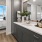 Spacious bathroom with ample light and large mirror