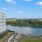 a body of water with buildings and trees around it